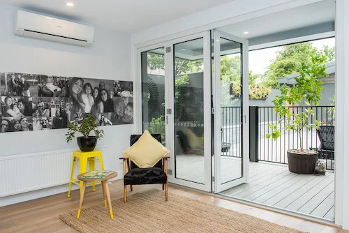 Medium shot of uPVC bi fold doors leading through to outdoor garden area